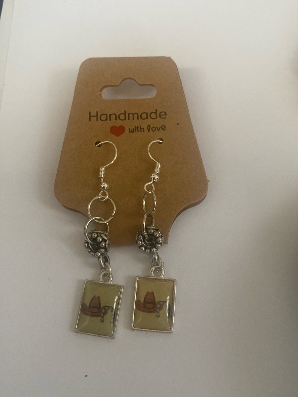 Handcrafted Silver-Tone Western Hat Dangle Earrings - Yellow Accent